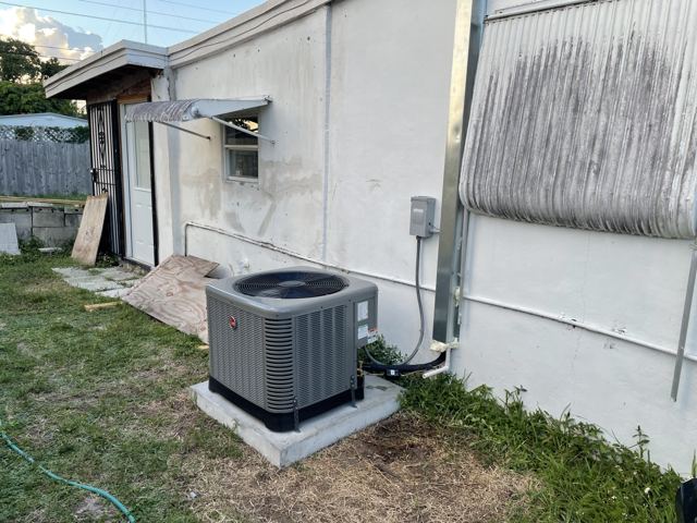 Condenser on a new pad — Clean pad-mounted install with new disconnect and lineset (Wonder Air & Heat, Brevard County FL)