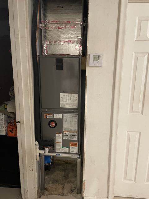 Slim-closet vertical unit — Narrow-profile air handler fitted to a hallway closet with new stat (Wonder Air & Heat, Brevard County FL)