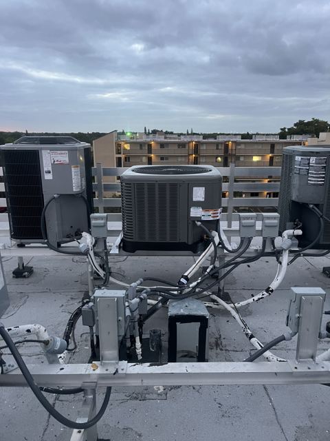 Rooftop equipment rebuild — Multiple rooftop systems re-set with new whips, disconnects, and stands (Wonder Air & Heat, Brevard County FL)