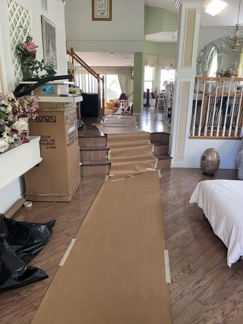 We protect your home first — Floor protection laid door-to-closet before any equipment moves inside (Wonder Air & Heat, Brevard County FL)