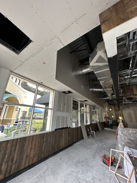 Commercial build-out ductwork — New spiral and rectangular duct hung through a retail build-out (Wonder Air & Heat, Brevard County FL)