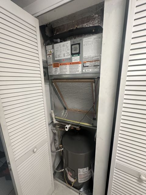 Inspection with the doors open — Honest walk-through of an aging closet system before quoting (Wonder Air & Heat, Brevard County FL)