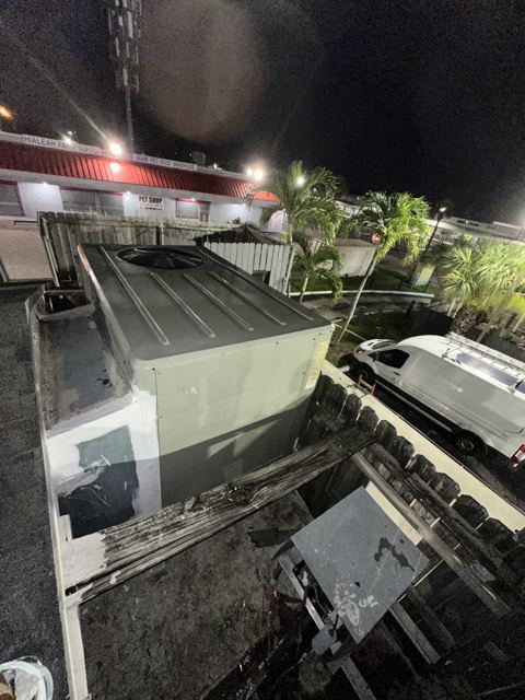 Night service — rooftop unit — After-hours commercial work with a weather-housed rooftop system (Wonder Air & Heat, Brevard County FL)